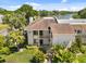 A charming condo shows inviting landscaping and direct access to nearby lake at 108 Lakeview Ct # 108, Oldsmar, FL 34677