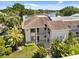 Aerial view of the condo building showcasing its proximity to a beautiful, serene lake at 108 Lakeview Ct # 108, Oldsmar, FL 34677