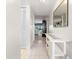 Hallway with tile floors and a decorative table that flows into the living room at 108 Lakeview Ct # 108, Oldsmar, FL 34677