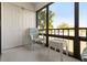 Relaxing lanai seating with a view of mature trees at 108 Lakeview Ct # 108, Oldsmar, FL 34677