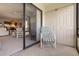 Comfortable lanai seating with view through sliding glass doors to living area at 108 Lakeview Ct # 108, Oldsmar, FL 34677