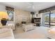 Bright living room with a stone fireplace, comfortable seating, and large windows for natural light and views at 108 Lakeview Ct # 108, Oldsmar, FL 34677