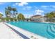 Enjoy this sparkling community pool with ample seating and lush landscaping at 108 Lakeview Ct # 108, Oldsmar, FL 34677