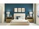A bedroom with rich blue walls, complemented by stylish wall art and bright natural light at 10823 Fort White Ct, Tampa, FL 33647