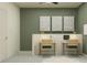 Dual workstation home office featuring modern decor, complementary lamps, and a calm aesthetic at 10823 Fort White Ct, Tampa, FL 33647