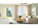 Bright and airy living room featuring a sectional sofa and large sliding glass doors at 10823 Fort White Ct, Tampa, FL 33647