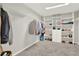 Walk-in closet with built-in shelving and ample storage space at 11118 Running Pine Dr, Riverview, FL 33569