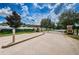Gated community entrance with stone pillars and well-maintained landscaping at 11118 Running Pine Dr, Riverview, FL 33569