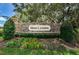 Stone monument sign for Moss Landing community with manicured landscaping and mature trees in the background at 11118 Running Pine Dr, Riverview, FL 33569
