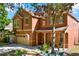 Charming two-story home with neutral-toned exterior, covered porch, and manicured lawn at 11118 Running Pine Dr, Riverview, FL 33569