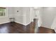 Upstairs hallway with hardwood floors leading to bedrooms at 11118 Running Pine Dr, Riverview, FL 33569
