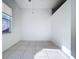 Bright bedroom with neutral walls and tile flooring throughout the house at 11535 Wellman Dr, Riverview, FL 33578
