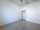 Bright bedroom with tiled flooring and walk-in closet with open doors at 11535 Wellman Dr, Riverview, FL 33578