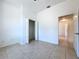 Bedroom with closet and entry to the next room through an open door at 11535 Wellman Dr, Riverview, FL 33578