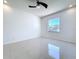 Bedroom featuring tiled floors, neutral walls, and a large window for natural light at 11535 Wellman Dr, Riverview, FL 33578