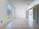 Bright living room with large window, neutral walls, and tile flooring at 11535 Wellman Dr, Riverview, FL 33578