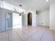 Bright living room with neutral walls and tile flooring throughout the house at 11535 Wellman Dr, Riverview, FL 33578