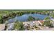 Lovely aerial view capturing the neighborhood's scenic waterfront homes surrounded by lush greenery at 11639 Sunshine Pond Rd, Tampa, FL 33635