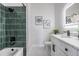 Modern bathroom featuring decorative tile in shower and backlit mirror at 11639 Sunshine Pond Rd, Tampa, FL 33635