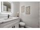 Bathroom with stylish vanity, modern fixtures, and decorative wall art at 11639 Sunshine Pond Rd, Tampa, FL 33635