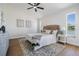 Inviting bedroom with plush rug, natural light, and scenic views of the lake at 11639 Sunshine Pond Rd, Tampa, FL 33635