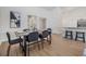 Spacious dining area with modern decor, laminate flooring, and easy access to kitchen at 11639 Sunshine Pond Rd, Tampa, FL 33635