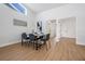 Bright dining room with laminate flooring, modern furniture, and ample natural light at 11639 Sunshine Pond Rd, Tampa, FL 33635