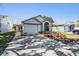 Charming single-story home with a well-maintained lawn and attached one car garage at 11639 Sunshine Pond Rd, Tampa, FL 33635