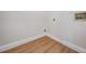 Small laundry room area with wood look flooring at 11639 Sunshine Pond Rd, Tampa, FL 33635