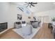 Open-concept living room with fireplace, high ceilings, and modern decor with ample seating at 11639 Sunshine Pond Rd, Tampa, FL 33635