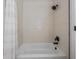 Clean shower with white tile and modern, dark fixtures at 11639 Sunshine Pond Rd, Tampa, FL 33635