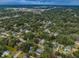 Aerial view of a home's roof with tree coverage and a shed at 1205 E Hamilton Ave, Tampa, FL 33604