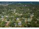 An aerial view of a neighborhood with many trees and houses at 1205 E Hamilton Ave, Tampa, FL 33604