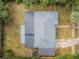 Aerial view of the home's roof, yard, and surrounding foliage at 1205 E Hamilton Ave, Tampa, FL 33604