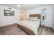 Bedroom with ceiling fan and an ensuite bathroom at 1205 E Hamilton Ave, Tampa, FL 33604