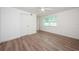 Inviting bedroom with a ceiling fan and wood look floors at 1205 E Hamilton Ave, Tampa, FL 33604