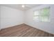 This bright bedroom offers natural light and wood floors, creating a clean and modern space at 1205 E Hamilton Ave, Tampa, FL 33604