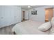 Bedroom featuring neutral tones, wood-look floors, and a double door closet at 1205 E Hamilton Ave, Tampa, FL 33604
