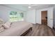 Bedroom with sliding glass doors to the patio and convenient closet storage at 1205 E Hamilton Ave, Tampa, FL 33604