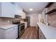 Modern kitchen equipped with stainless appliances, white cabinetry, and ample counter space at 1205 E Hamilton Ave, Tampa, FL 33604