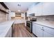 Contemporary kitchen featuring stainless steel appliances and white cabinets at 1205 E Hamilton Ave, Tampa, FL 33604