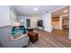 Inviting living room featuring modern furniture, wood flooring, and ample natural light at 1205 E Hamilton Ave, Tampa, FL 33604