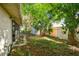 Backyard area with a shed and lush greenery surrounded by a fence, providing a serene retreat at 1219 Michigan N Dr, Dunedin, FL 34698