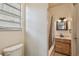 Cozy bathroom featuring a shower and bathtub combo and a wood vanity at 1219 Michigan N Dr, Dunedin, FL 34698