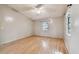Empty bedroom with hardwood flooring, a window, a ceiling fan, and neutral walls at 1219 Michigan N Dr, Dunedin, FL 34698