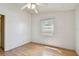 Basic bedroom design with light-colored walls and wood laminate flooring; a window provides natural light at 1219 Michigan N Dr, Dunedin, FL 34698