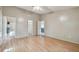 Spacious bedroom with hardwood floors, a closet, and views of the bathroom and kitchen at 1219 Michigan N Dr, Dunedin, FL 34698