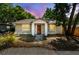 Charming bungalow featuring a well-kept front yard and inviting entryway at 1219 Michigan N Dr, Dunedin, FL 34698