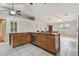 Open kitchen island is well-equipped with stainless steel appliances and seating for four at 1219 Michigan N Dr, Dunedin, FL 34698