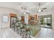 Open kitchen boasts a large island with seating, stainless steel appliances, and tile floors at 1219 Michigan N Dr, Dunedin, FL 34698